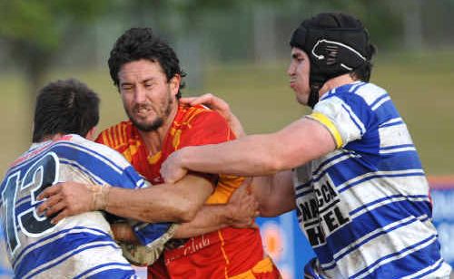 Coffs Harbour’s Ben McCarthy tries to crash through. Coffs Harbour’s Ben McCarthy tries to crash through.